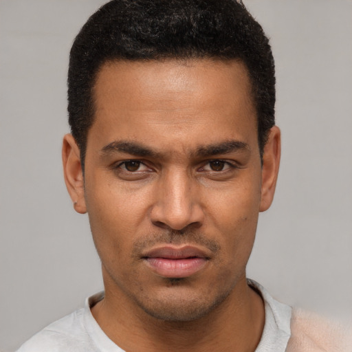Neutral latino young-adult male with short  black hair and brown eyes