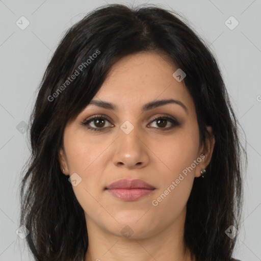 Joyful latino young-adult female with long  brown hair and brown eyes