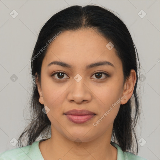 Joyful latino young-adult female with medium  black hair and brown eyes