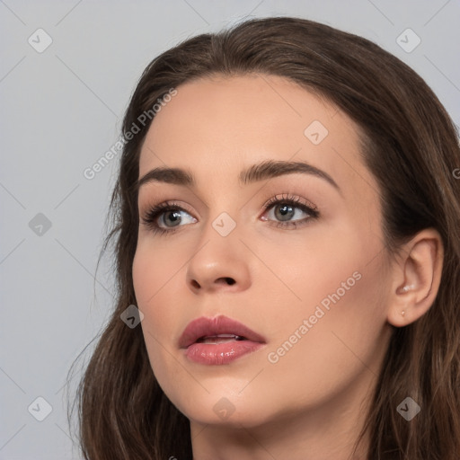 Neutral white young-adult female with long  brown hair and brown eyes