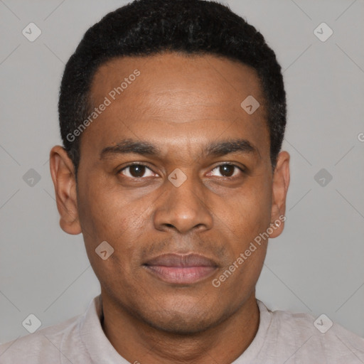 Joyful black young-adult male with short  black hair and brown eyes