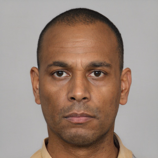 Neutral latino adult male with short  black hair and brown eyes