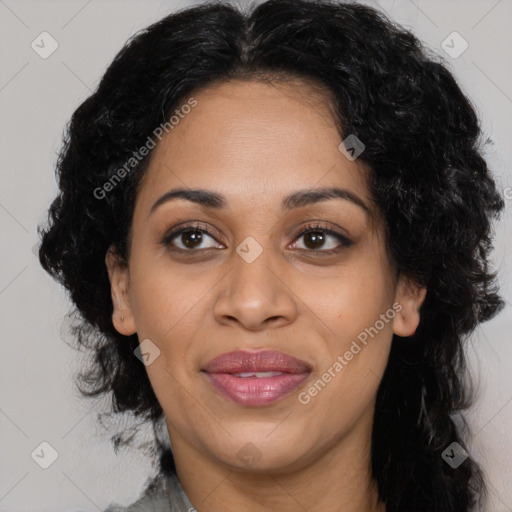 Joyful latino adult female with long  black hair and brown eyes