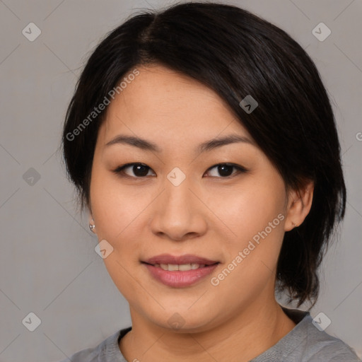 Joyful asian young-adult female with medium  black hair and brown eyes