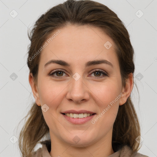 Joyful white young-adult female with medium  brown hair and grey eyes