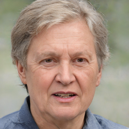 Joyful white middle-aged female with medium  gray hair and blue eyes