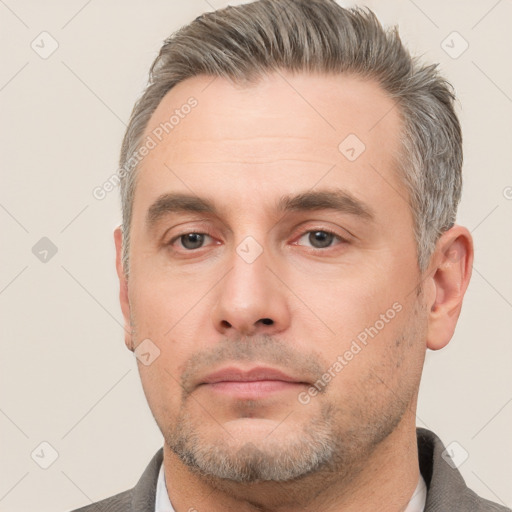 Neutral white adult male with short  brown hair and brown eyes