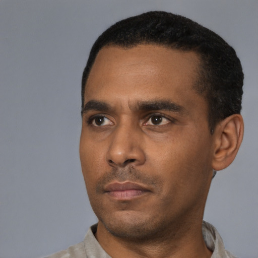 Neutral black young-adult male with short  black hair and brown eyes