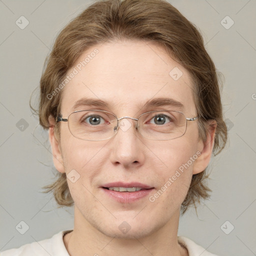 Joyful white adult female with medium  brown hair and blue eyes