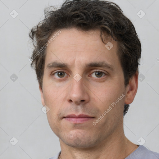 Neutral white adult male with short  brown hair and brown eyes