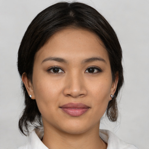 Joyful asian young-adult female with medium  brown hair and brown eyes