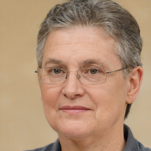 Joyful white middle-aged female with short  brown hair and brown eyes