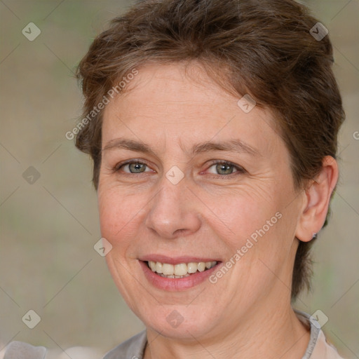 Joyful white adult female with short  brown hair and brown eyes