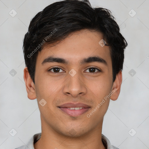 Joyful latino young-adult male with short  brown hair and brown eyes