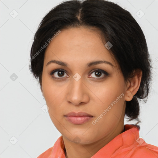 Joyful latino young-adult female with medium  brown hair and brown eyes