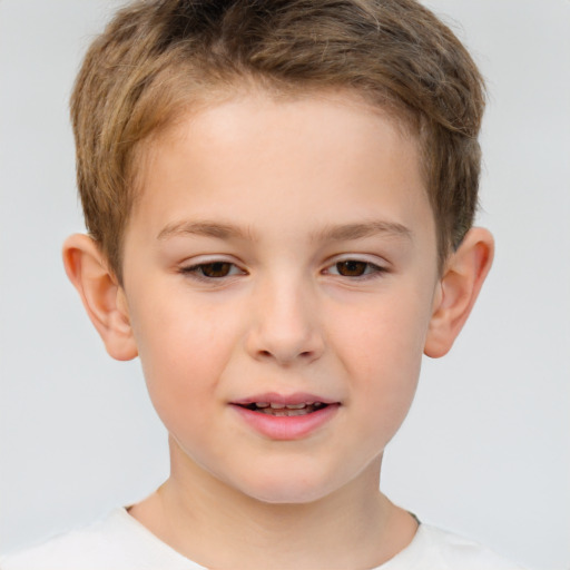 Joyful white child male with short  brown hair and brown eyes