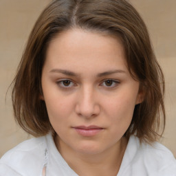 Neutral white young-adult female with medium  brown hair and brown eyes