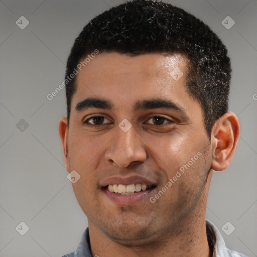 Joyful white young-adult male with short  black hair and brown eyes