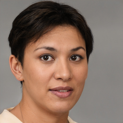 Joyful white young-adult female with short  brown hair and brown eyes