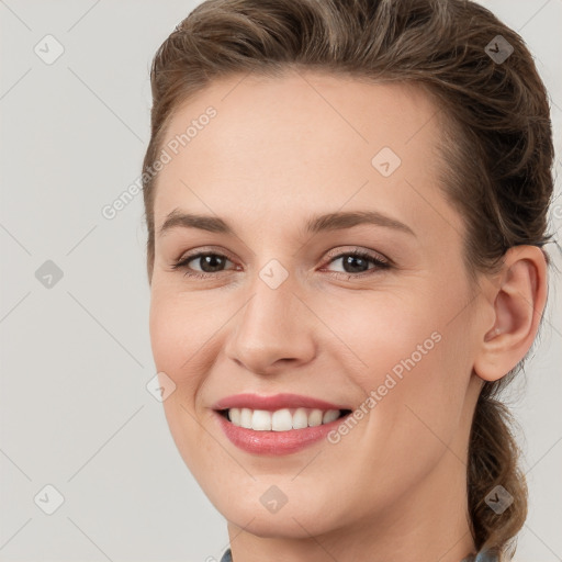 Joyful white young-adult female with medium  brown hair and grey eyes