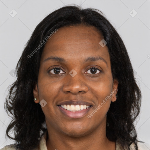 Joyful black young-adult female with long  brown hair and brown eyes