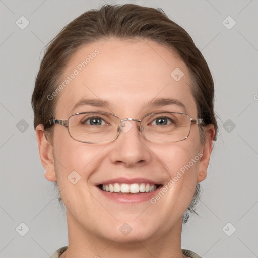 Joyful white adult female with short  brown hair and grey eyes