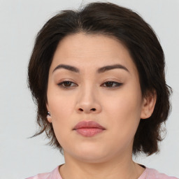 Neutral asian young-adult female with medium  brown hair and brown eyes