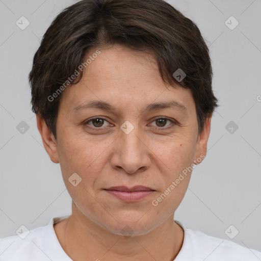 Joyful white adult female with short  brown hair and brown eyes