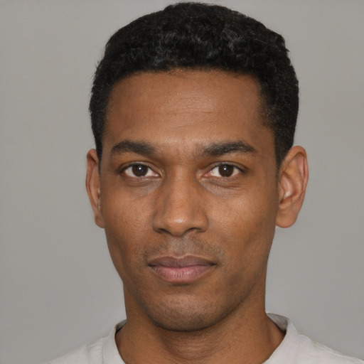 Neutral black young-adult male with short  black hair and brown eyes