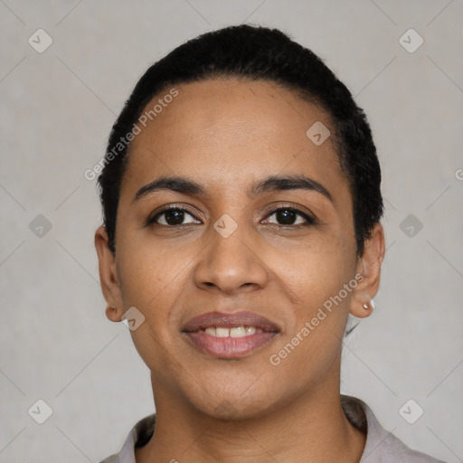 Joyful latino young-adult female with short  black hair and brown eyes