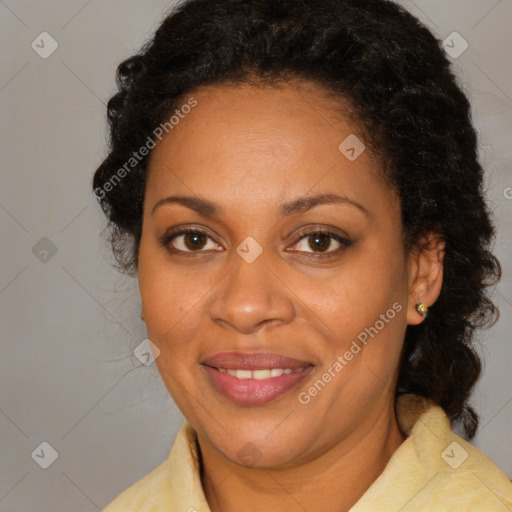 Joyful black adult female with medium  brown hair and brown eyes