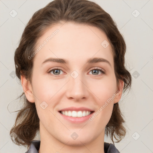 Joyful white young-adult female with medium  brown hair and grey eyes