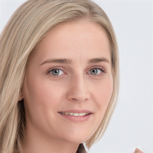 Joyful white young-adult female with medium  brown hair and blue eyes