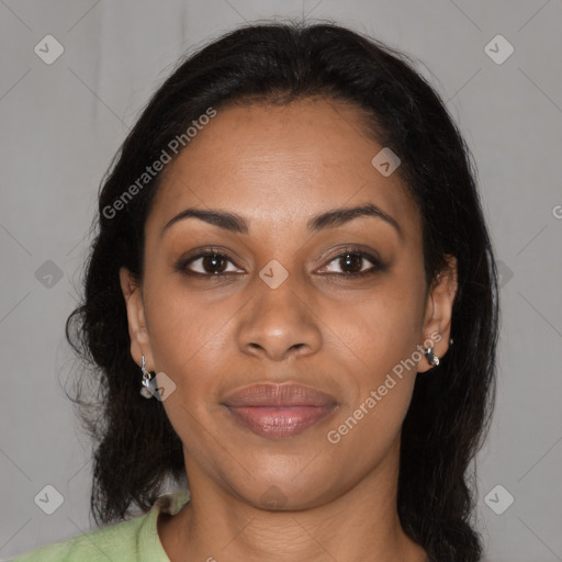 Joyful black young-adult female with long  brown hair and brown eyes