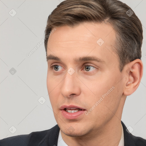 Joyful white adult male with short  brown hair and brown eyes