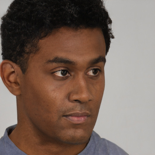 Neutral black young-adult male with short  brown hair and brown eyes