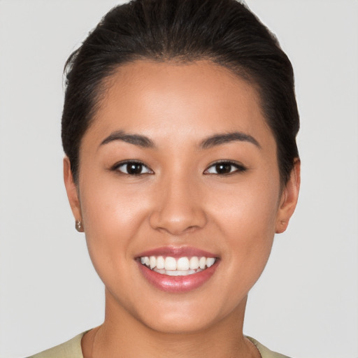 Joyful white young-adult female with short  brown hair and brown eyes