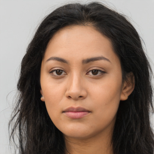 Neutral latino young-adult female with long  brown hair and brown eyes