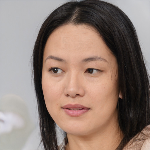 Neutral asian young-adult female with long  brown hair and brown eyes