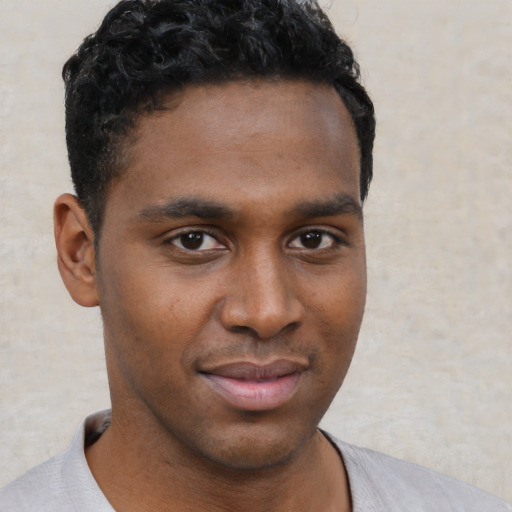 Neutral black young-adult male with short  brown hair and brown eyes