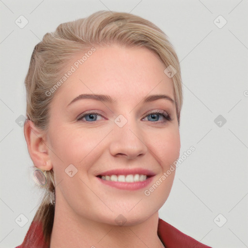 Joyful white young-adult female with long  brown hair and blue eyes