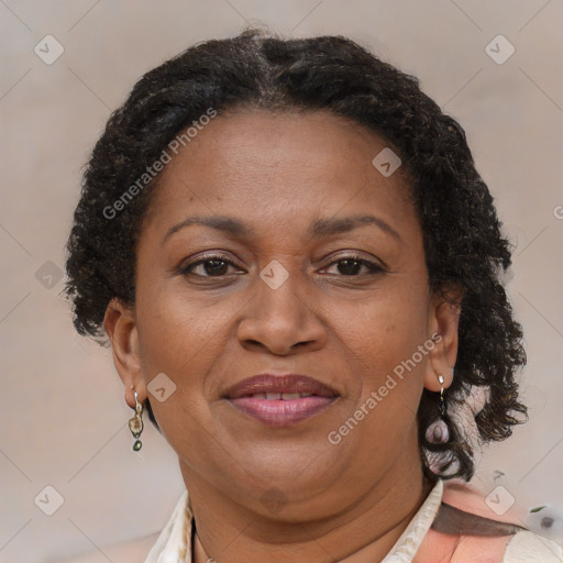 Joyful black adult female with short  brown hair and brown eyes