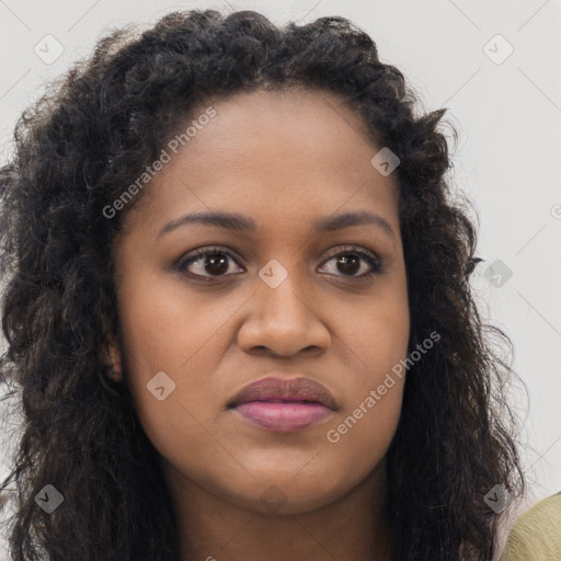 Joyful black young-adult female with long  brown hair and brown eyes