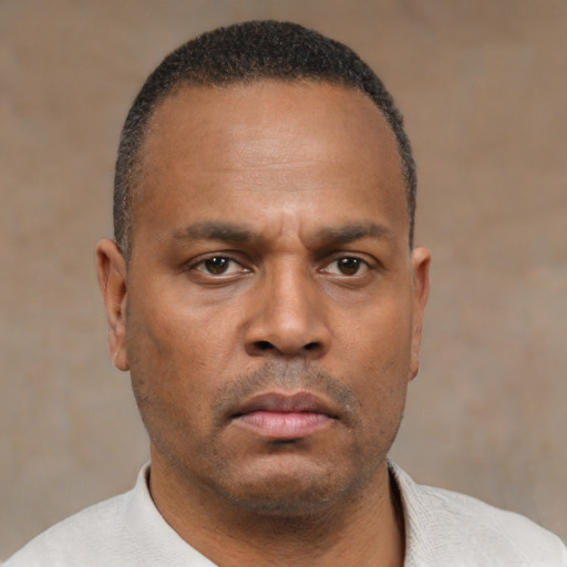 Neutral latino adult male with short  black hair and brown eyes