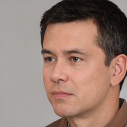 Neutral white adult male with short  black hair and brown eyes