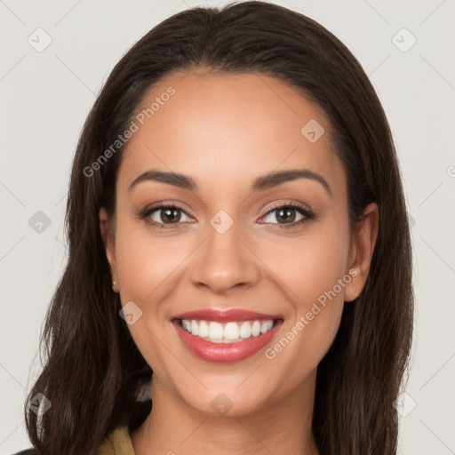 Joyful white young-adult female with long  brown hair and brown eyes