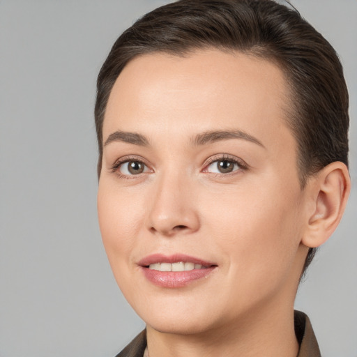 Joyful white young-adult female with short  brown hair and brown eyes