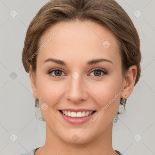 Joyful white young-adult female with medium  brown hair and green eyes