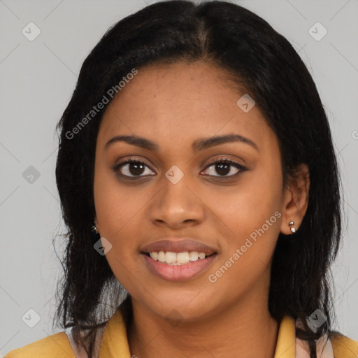 Joyful latino young-adult female with long  black hair and brown eyes