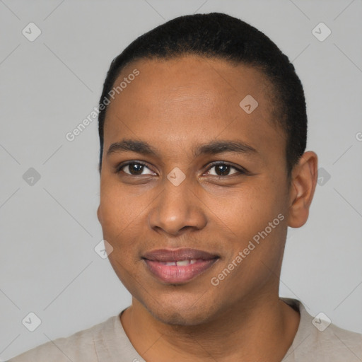 Joyful black young-adult male with short  black hair and brown eyes